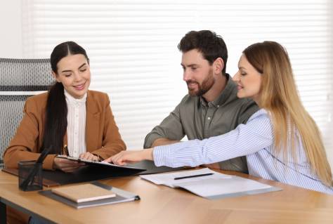 Couple having meeting with lawyer in office